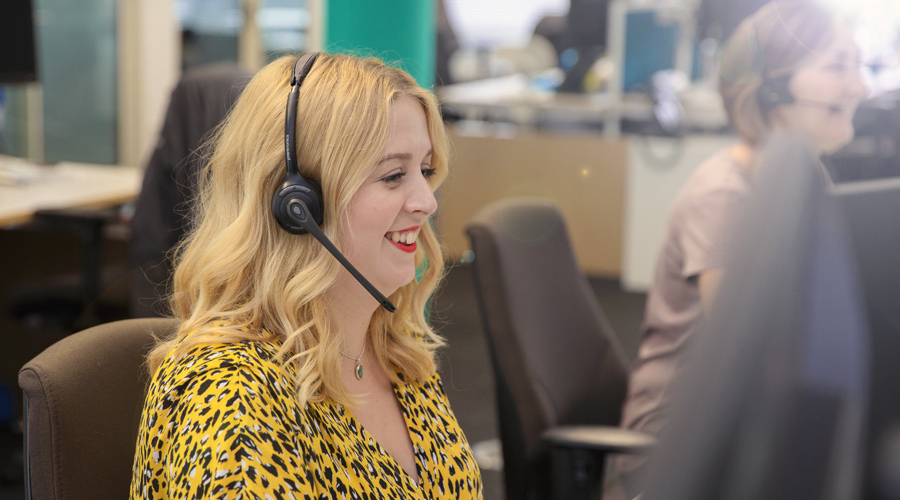 Customer commitments Smiling customer support member