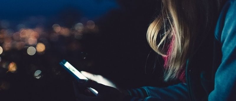 Secure woman holding phone