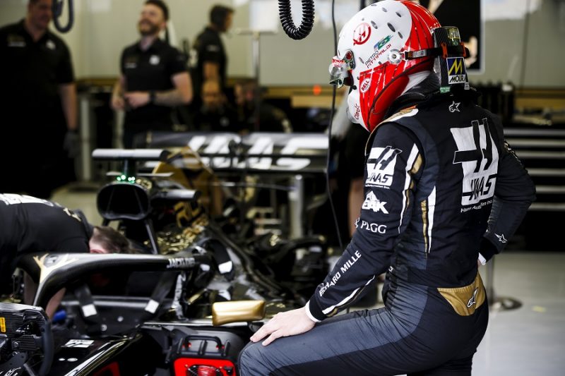 Haas full and mobile protection Haas driver looking at his car