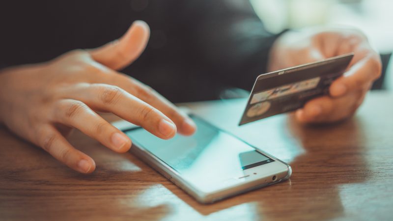 Technology Photos Mobile Phone Shopping Online With A Debit Card